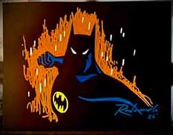 Example: Batman in an action pose, sketched in orange and blue on black paper