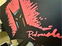 Example: Batman's head sketched in pink on black paper